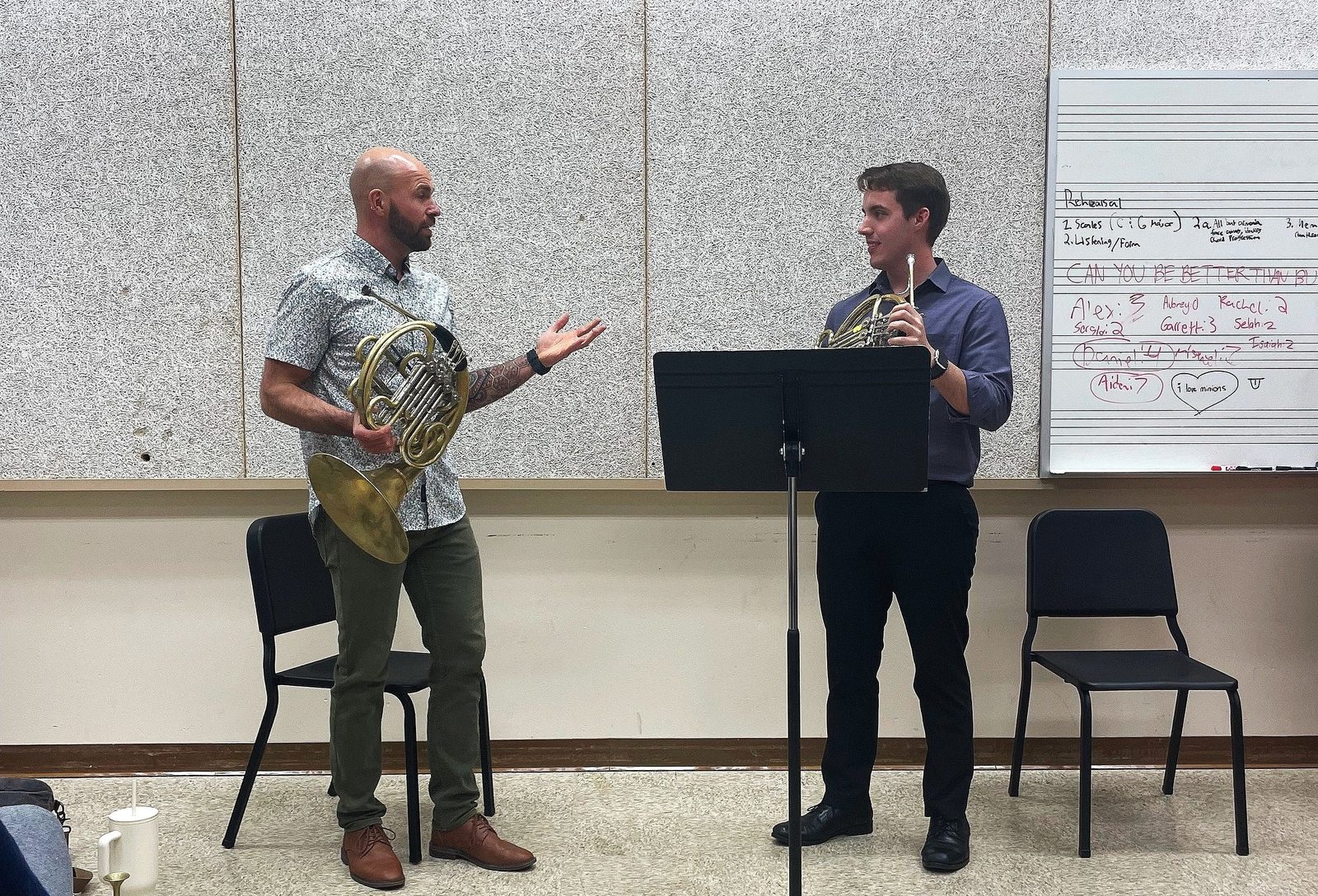 Dr. Rusty Holmes coaching a college horn student in a studio class
